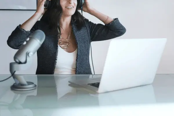 woman with brown hair recording her online course