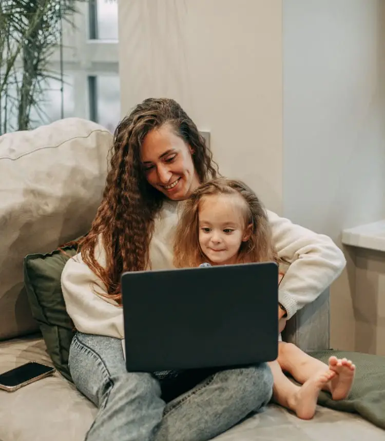 Mompreneur working with child on her lap